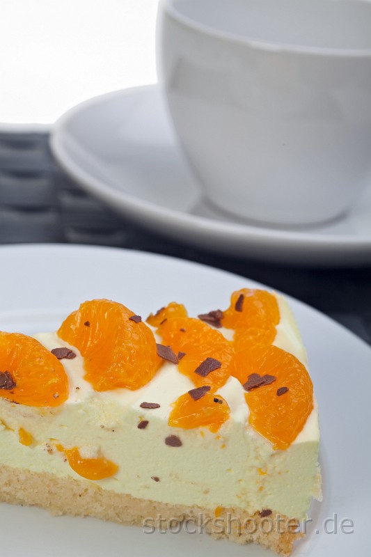 IMG_4279_cake.jpg - slice of tangerine cream cake on a white plate