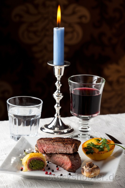 _MG_2132_steakcandle.jpg - steak with grilled potato on a plate
