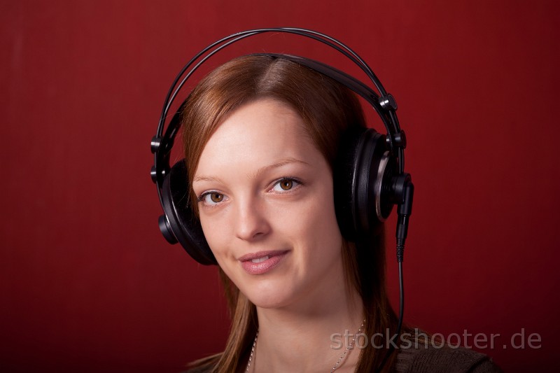 _MG_3206_phones.jpg - girl with headphones on red background