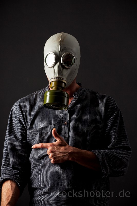 _MG_9057_mask.jpg - man in a gas mask on black background